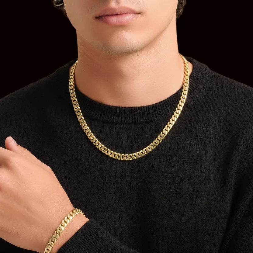 Tyronea 8mm gold Cuban link chain and bracelet set made from stainless steel with a polished finish.