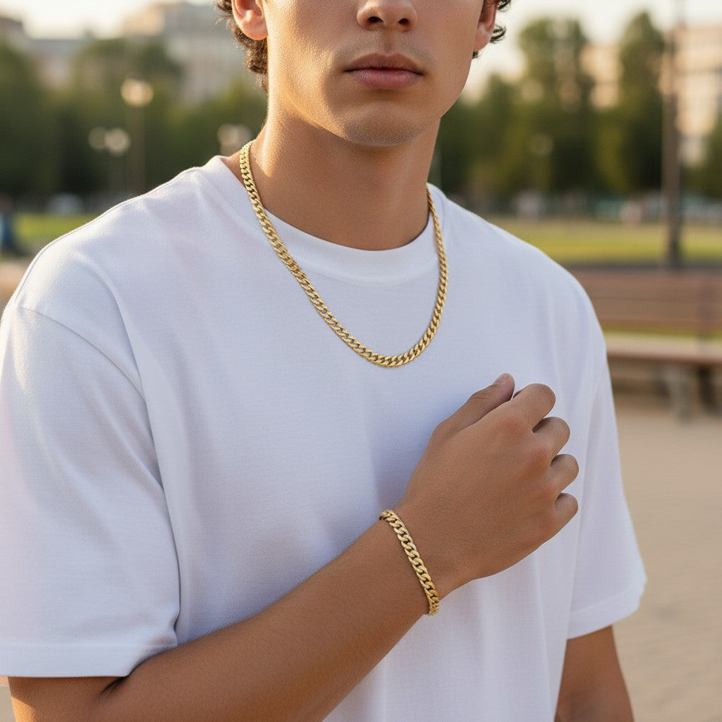 Tyronea 8mm gold Cuban link chain and bracelet set made of stainless steel with a polished finish.
