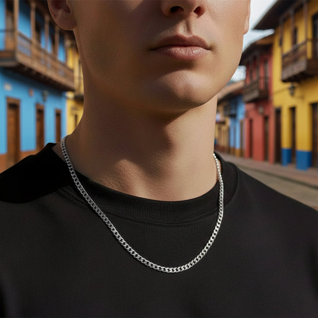 Tyrone 5mm silver Cuban link chain made of stainless steel with 14K gold bonding. Waterproof and hypoallergenic.