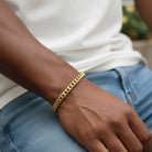 Tyrone 8mm gold Cuban link bracelet made of stainless steel with a polished finish and secure clasp.