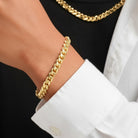 Tyronea 8mm gold Cuban link chain and bracelet set made of stainless steel with a polished finish.