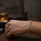 Tyrone 8mm polished silver stainless steel Cuban link bracelet with a secure clasp. Bold, modern statement jewelry.