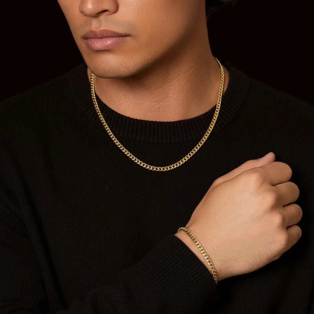 Tyrone 5mm gold Cuban link chain and bracelet set crafted from stainless steel with 14K gold plating.