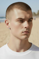 Tyrona men's square cut moissanite stud earrings in sterling silver with gold plating. 1ct each stone.